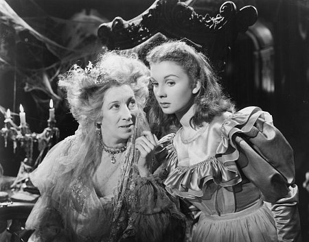 Wealthy spinster Miss Havisham (Martita Hunt) makes a wicked suggestion to Young Estella (Jean Simmons).