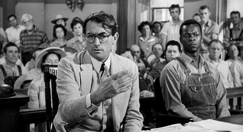 Atticus Finch (Gregory Peck) makes a point in defense of Tom Robinson (Brock Peters), accused of rape.