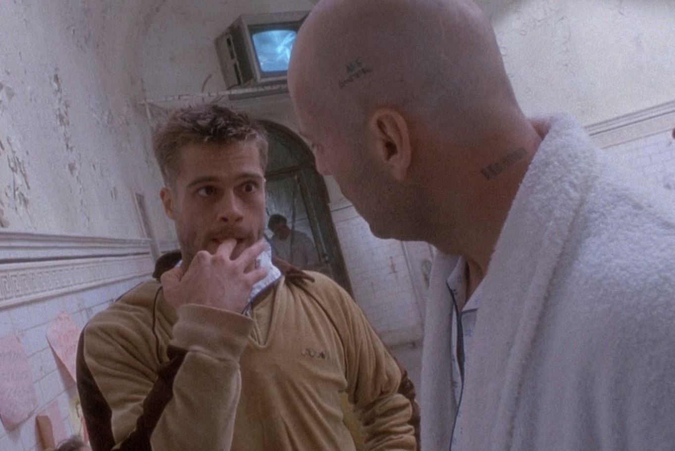 Deranged Brad Pitt faces hairless Bruce Willis.